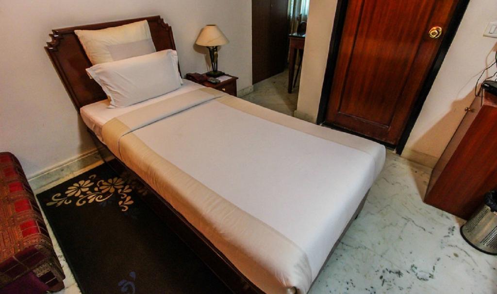 Hotel Pigeon International Bangalore Room photo