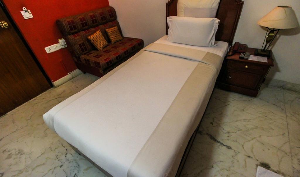 Hotel Pigeon International Bangalore Room photo